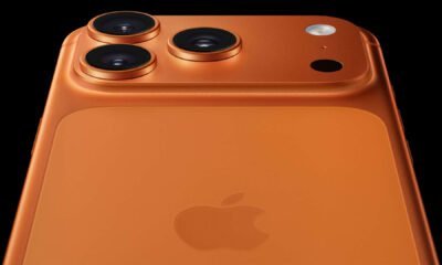 Câmera tripla do iPhone na cor laranja com design avançado e tecnologia de ponta.
