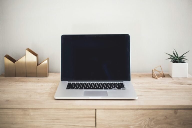 Not relevant, image of a laptop on a desk.