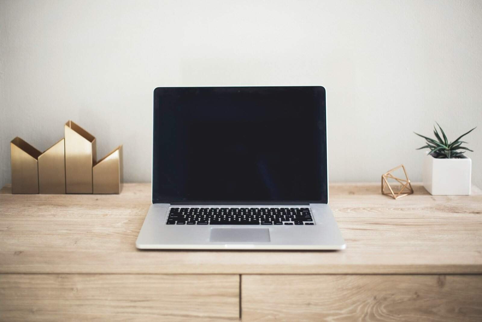 Not relevant, image of a laptop on a desk.