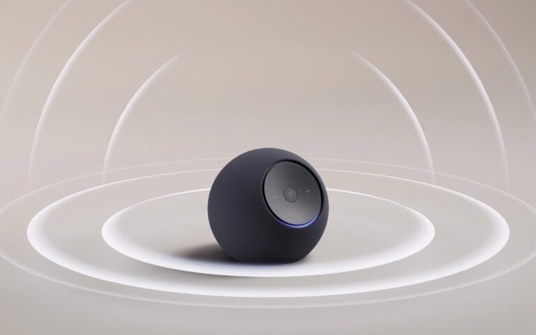 Bluetooth alto-falante portátil preto com controle de volume e luz LED, design compacto e moderníssimo.