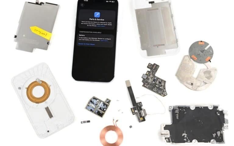 Componentes de reparo de smartphones desmontados, peças internas e hardware.