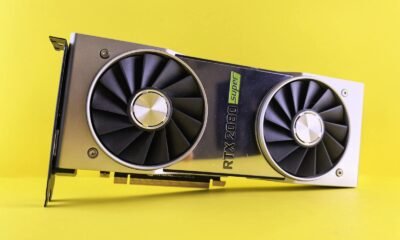 Close-up of a RTX 2080 Super graphics card against a bright yellow backdrop, showcasing high-tech design.